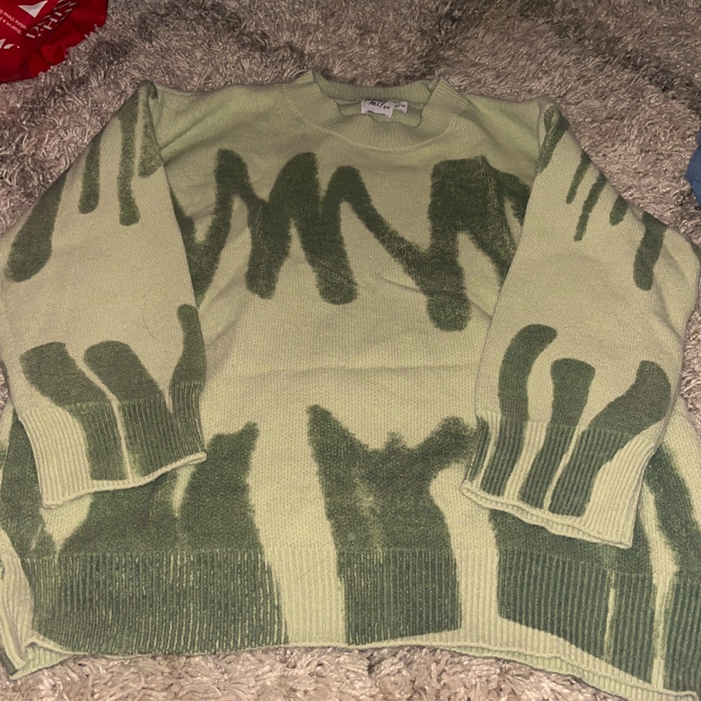 A crew neck sweater